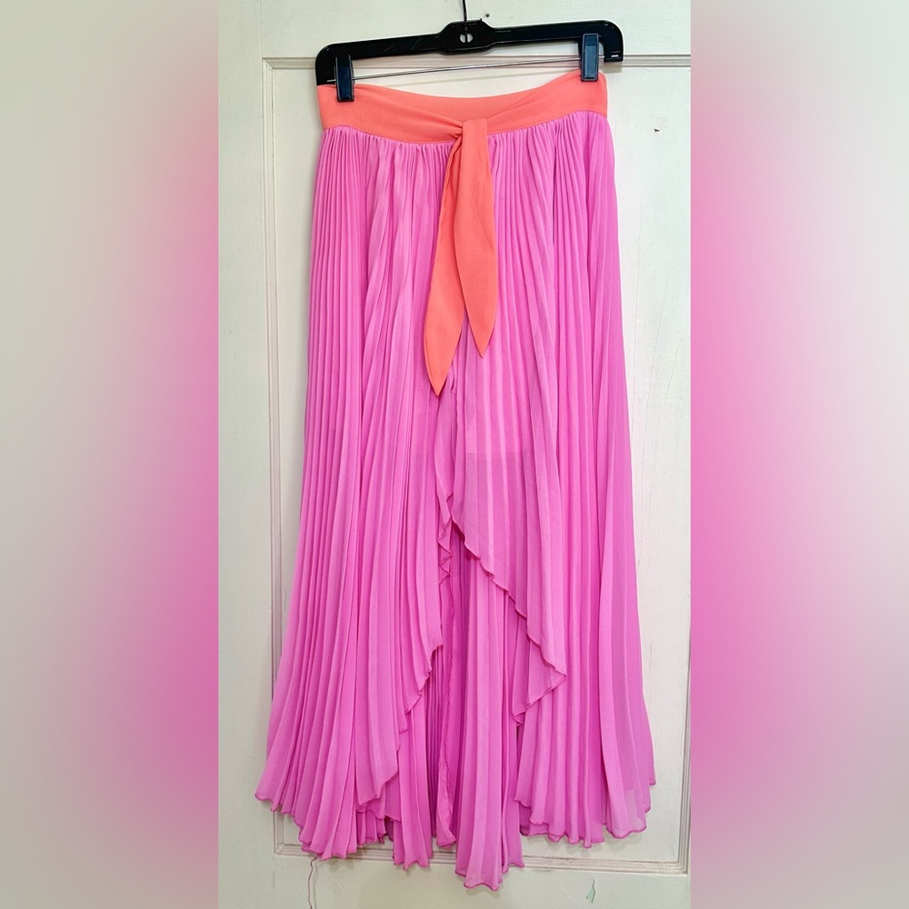 Impeccable Pig: Pink pleated midi skirt with coral color blocking